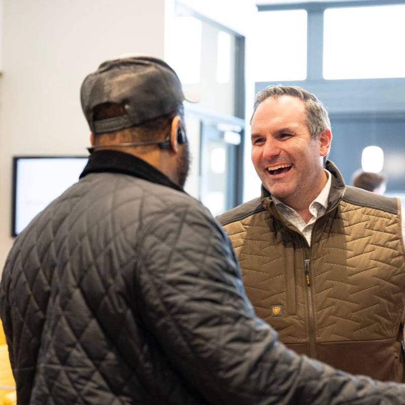 Attendees greeting each other