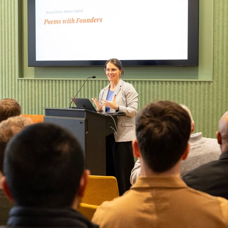 Speaker presenting to the audience